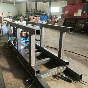 heavy equipment welding workshop fabrication large steel machine frame